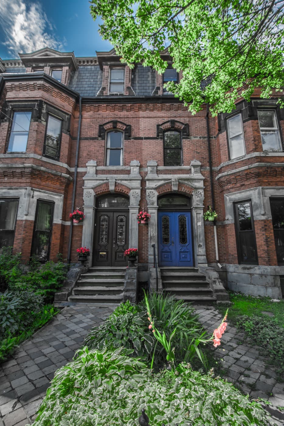 Victorian rowhouse with a blue door in uptown Saint John